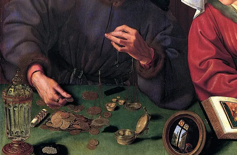 Close-up of a merchant’s hands weighing gold coins on small scales at a green table, beside a mirror and a book.